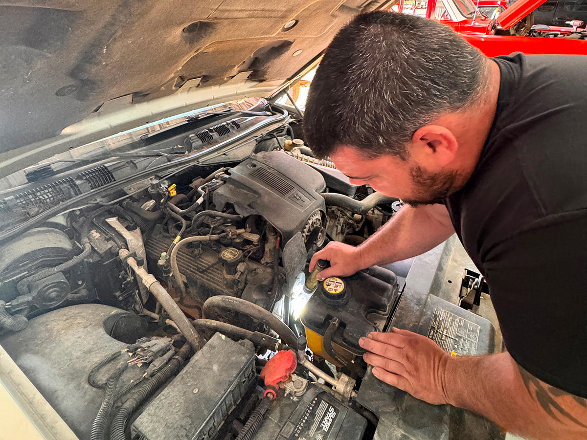 Professional auto tech running diagnostic testing. Honest Communication